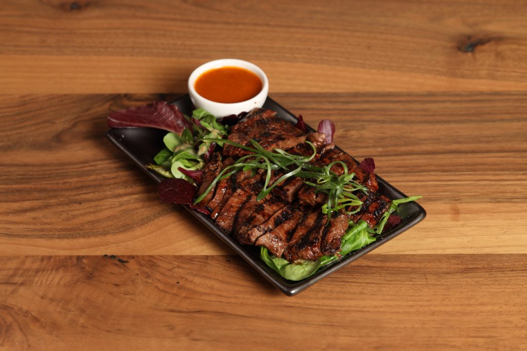 Bulgogi Beef stir-fry at OKA, a Pan Asian restaurant in London, showcasing authentic Korean flavours and fresh ingredients.